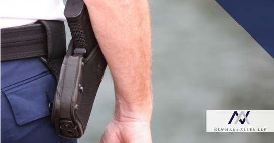 man with gun in holster and his arm hanging next to it
