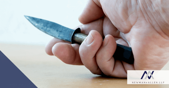 hand holding worn down knife