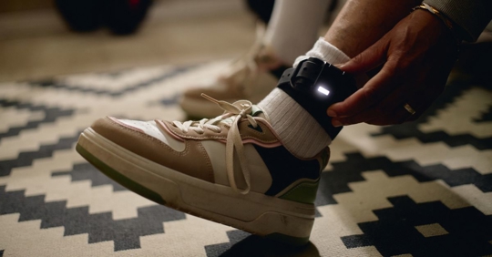ankle monitor on a person