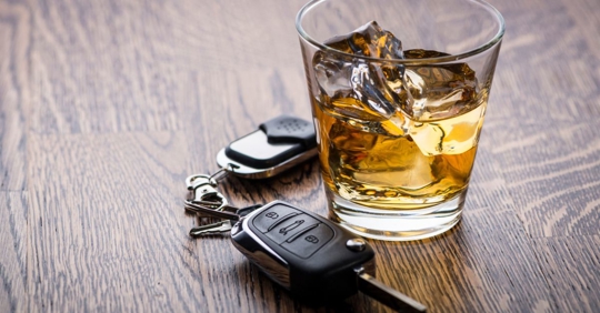 alcohol drink and car keys on a table