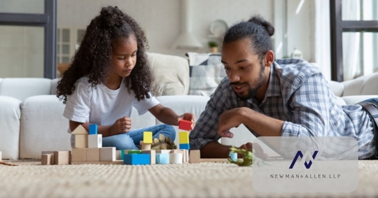 father playing with daughter after winning child custody