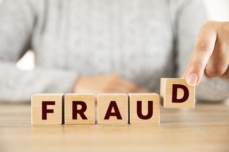 Fraud depicted in block letters