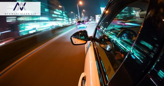 car speeding down highway at night, blurry view